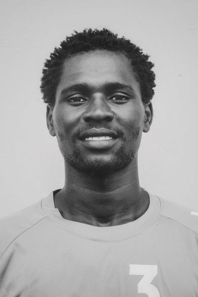 Close-up on a person's focused expression during exercise.